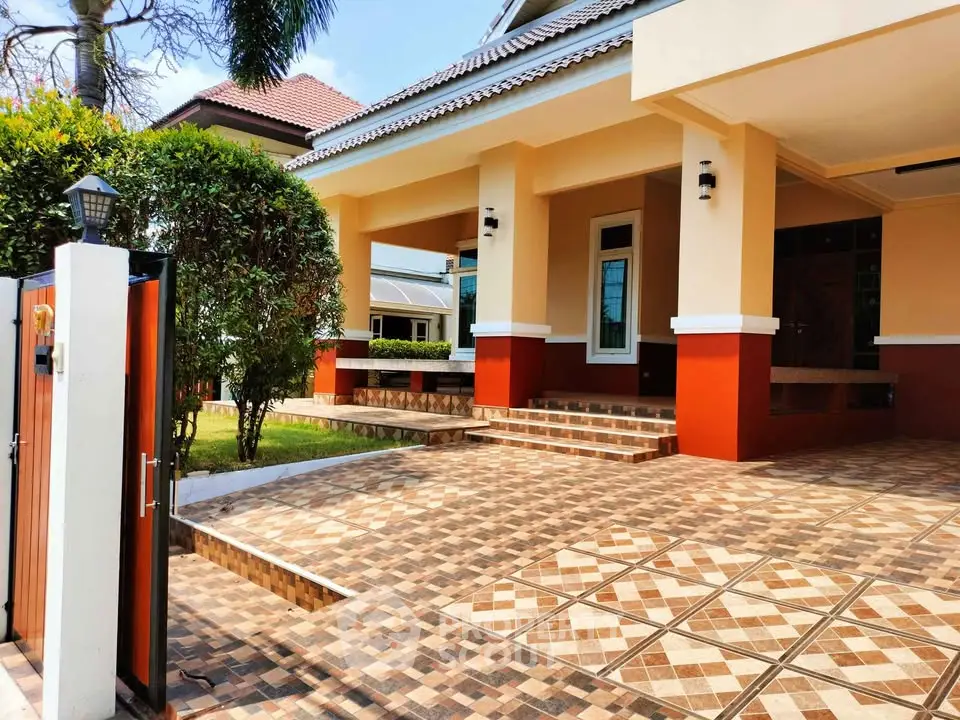 Charming suburban home with tiled entrance and lush greenery