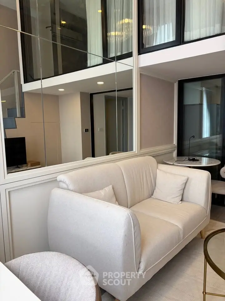 Modern duplex living room with stylish white sofa and elegant decor
