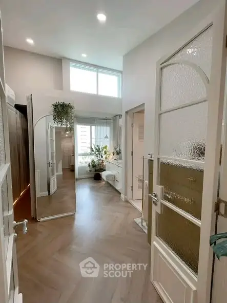 Stylish modern interior with elegant decor and natural light, featuring a cozy living space and chic design elements.