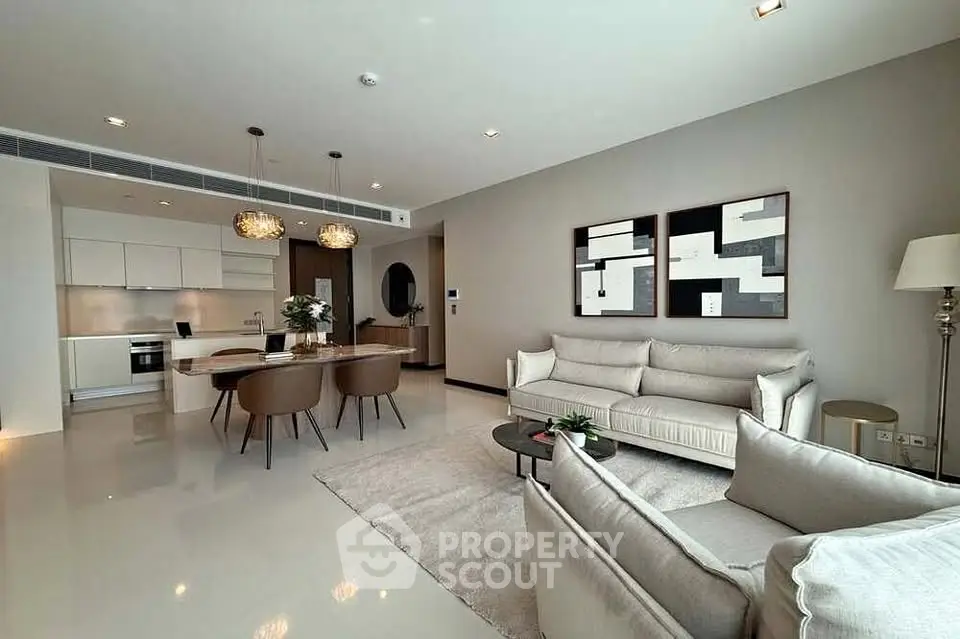 Luxurious open-plan living room with modern kitchen and elegant decor