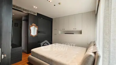 Modern bedroom with elegant decor and ample storage space