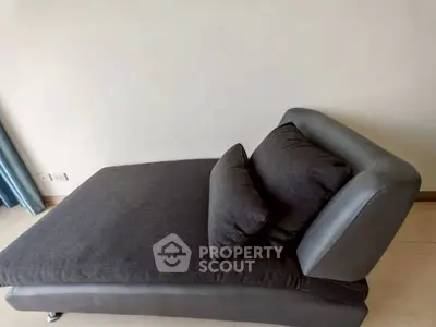 Stylish modern chaise lounge in a minimalist living room setting