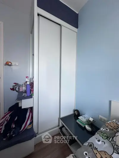 Cozy bedroom with built-in wardrobe and modern decor