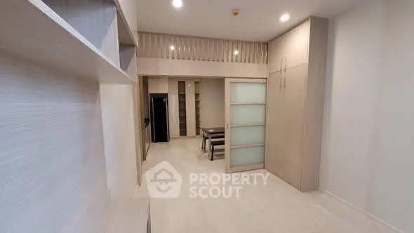 Modern minimalist apartment interior with open layout and sleek wooden finishes.