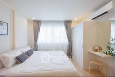 Bright and cozy bedroom with modern decor and ample natural light