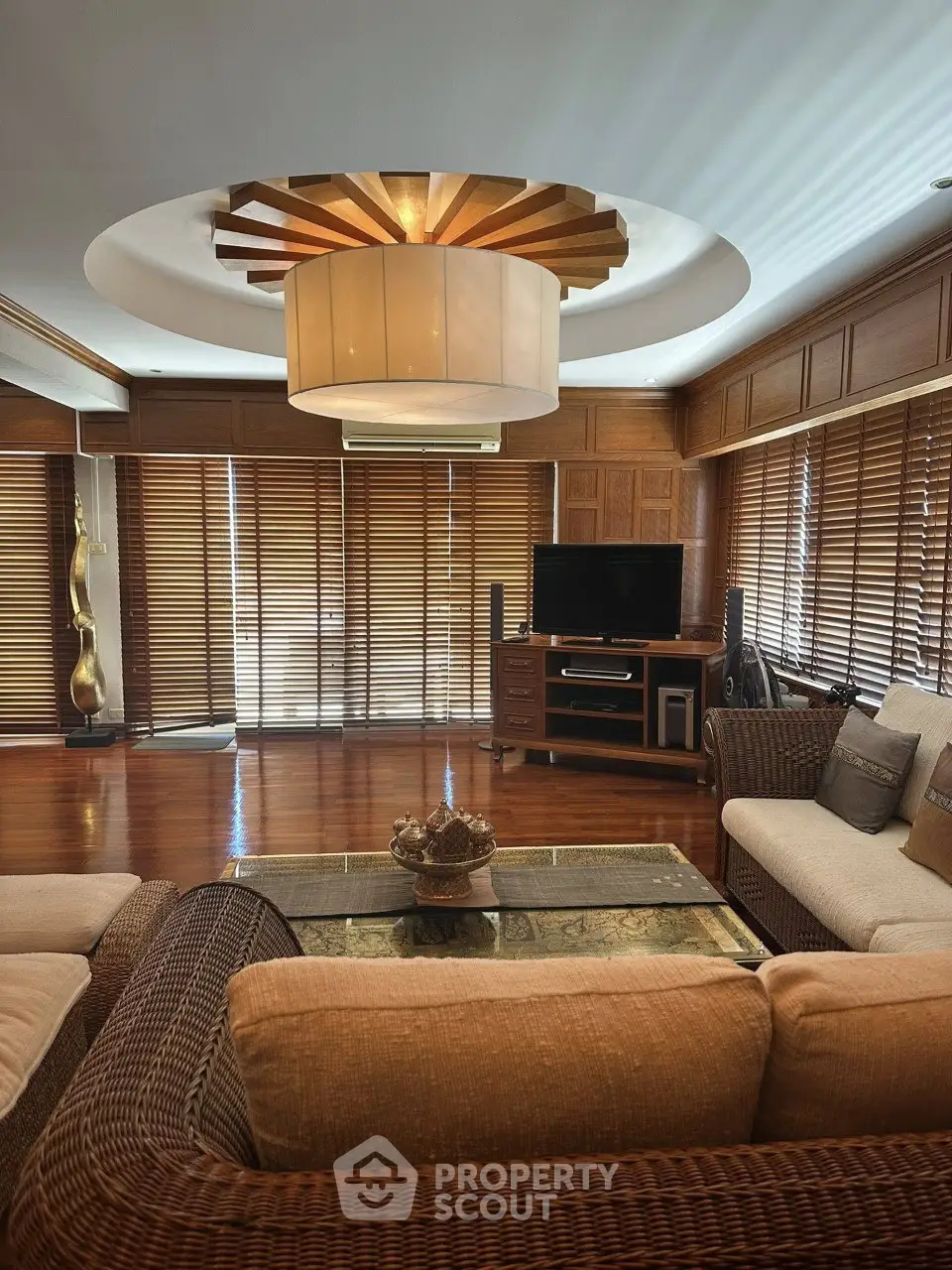 Luxurious living room with elegant wooden decor and modern furniture