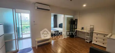 Spacious modern apartment with wooden flooring and balcony view