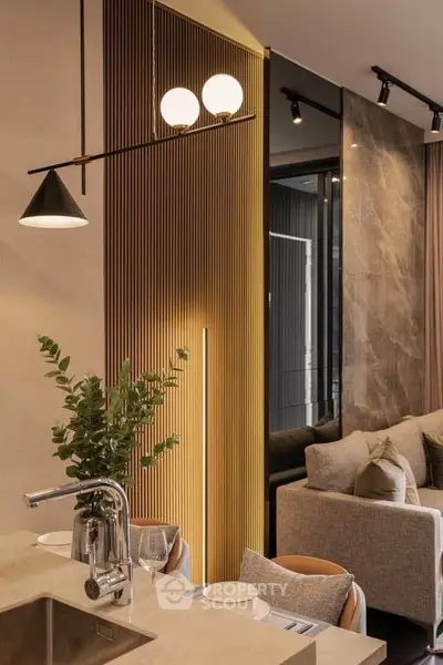 Luxurious modern living room with elegant decor and open kitchen layout, perfect for stylish urban living.