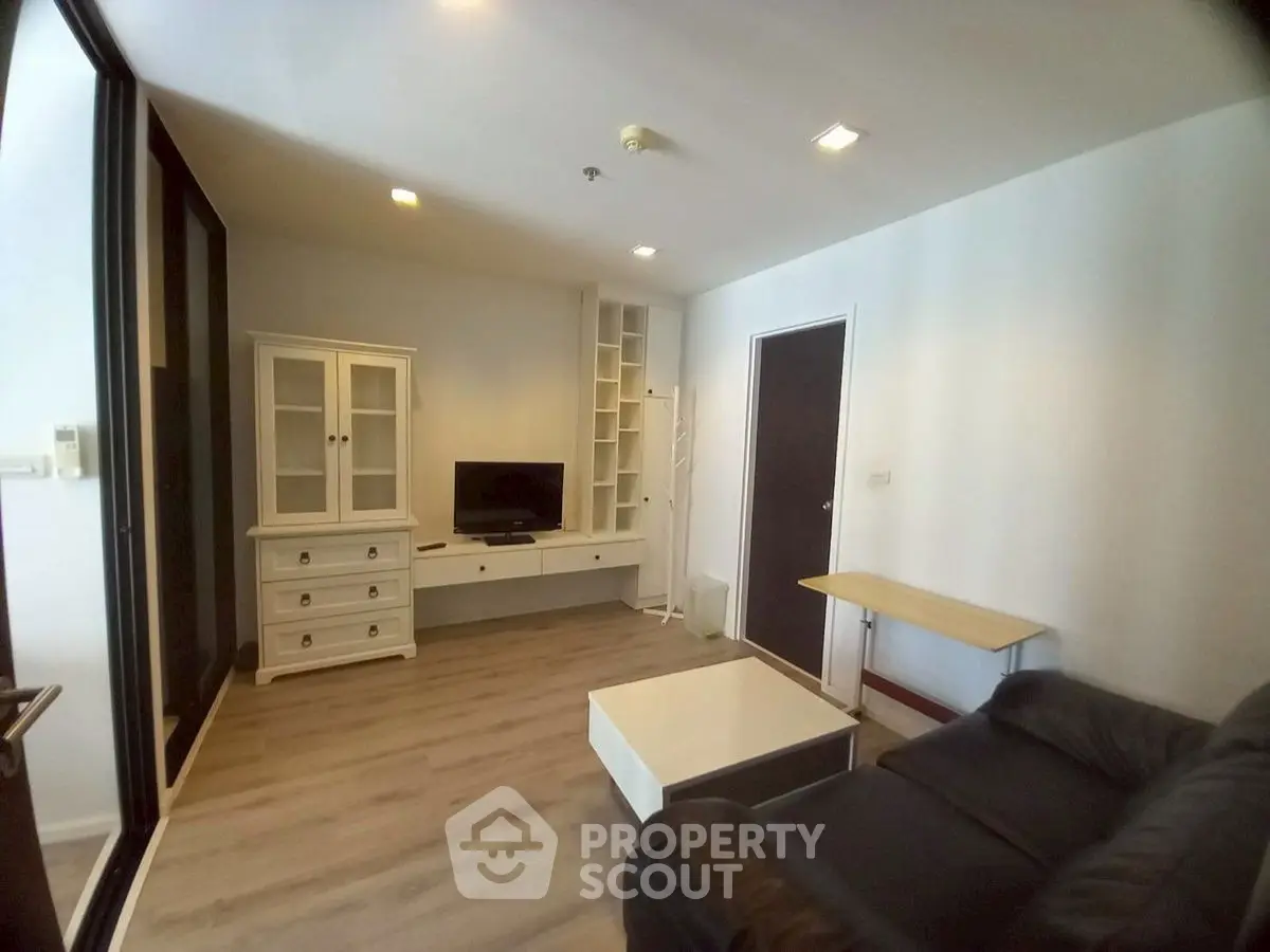 Modern living room with sleek furniture and built-in storage
