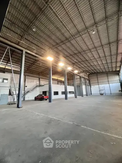 Spacious industrial warehouse with high ceilings and ample storage space.