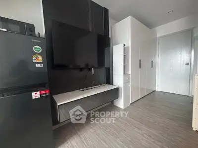 Modern living room with sleek TV setup and stylish storage solutions