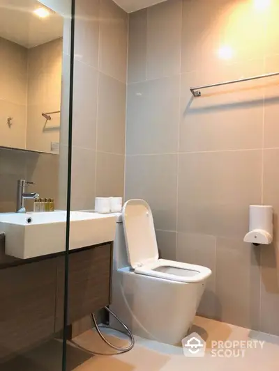 Modern bathroom with sleek design and elegant fixtures in a contemporary home.