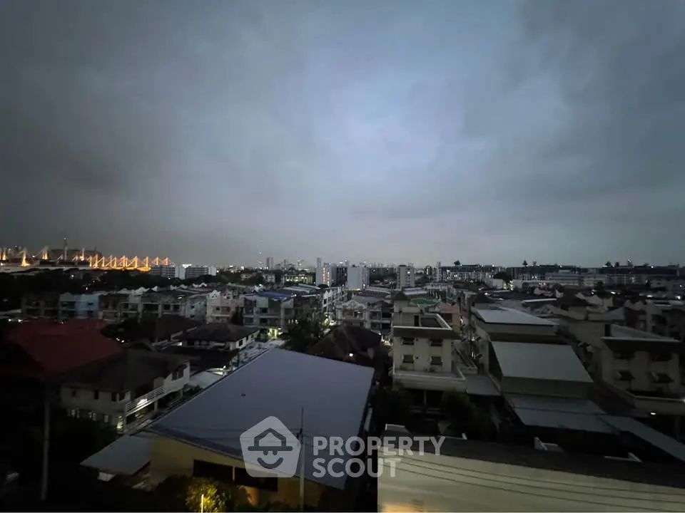 Stunning cityscape view from a high vantage point at dusk, showcasing urban living.