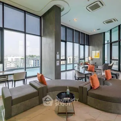 Luxurious modern living room with panoramic city views and stylish furniture.