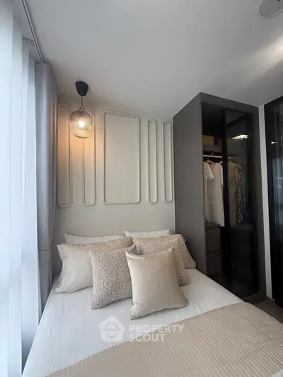 Elegant bedroom with modern decor and walk-in closet in luxury apartment