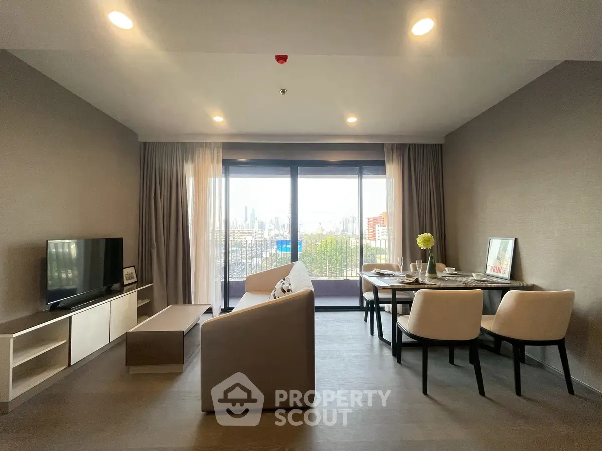 Spacious modern living room with city view, stylish furniture, and elegant dining area.