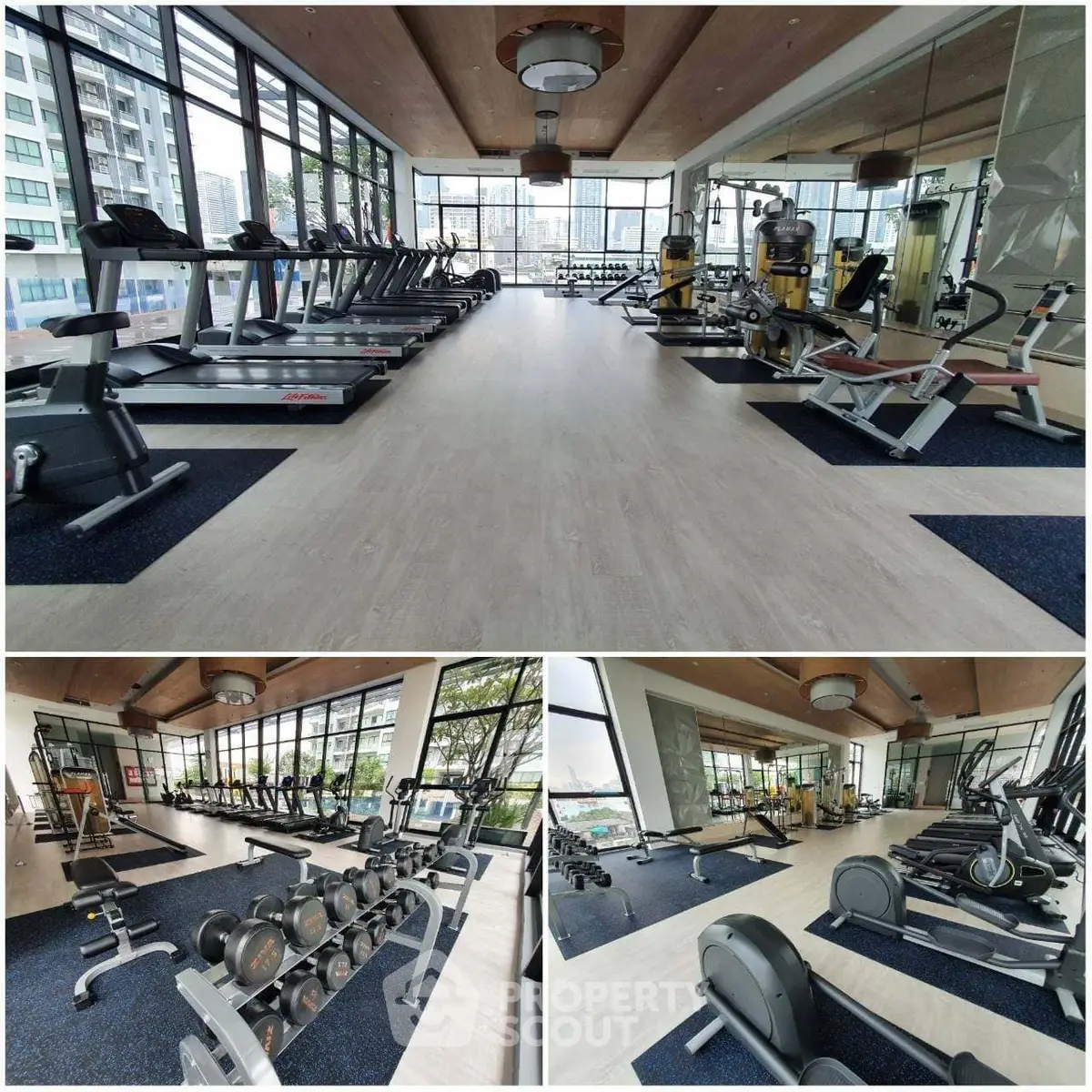 Spacious modern gym with state-of-the-art equipment and large windows offering a city view.