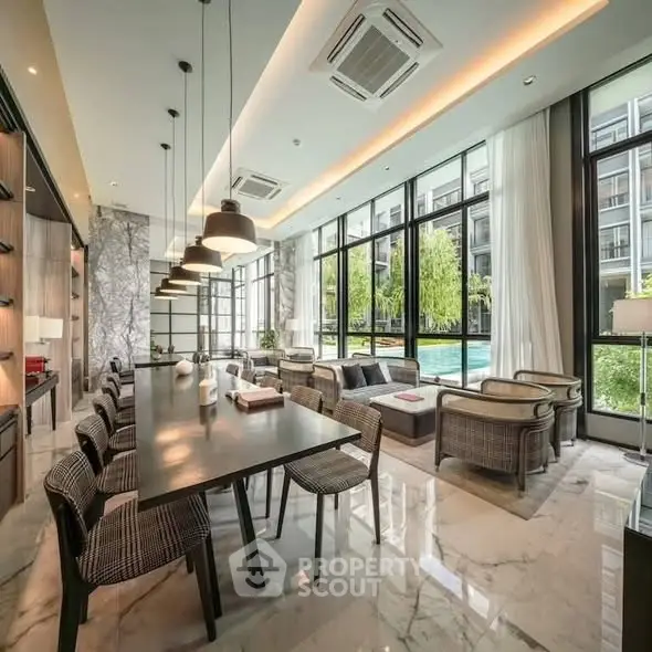 Luxurious modern living room with pool view and elegant furnishings