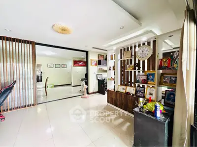 Spacious living room with modern decor and ample natural light
