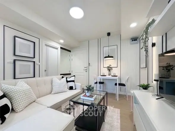 Modern living room with stylish decor and cozy seating area, perfect for relaxation and entertainment.