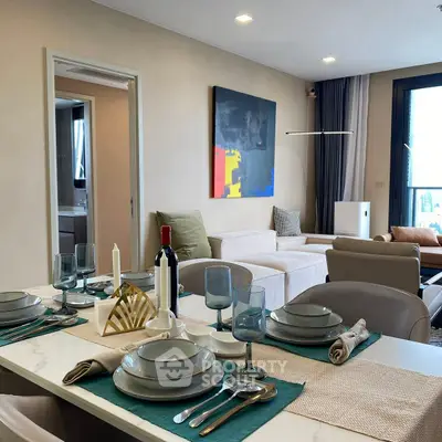 Modern living and dining area with stylish decor and natural light