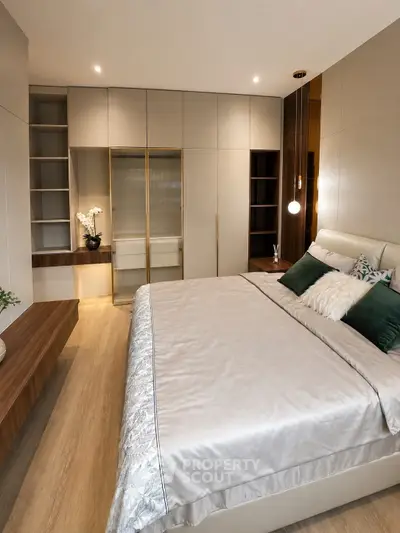 Luxurious modern bedroom with elegant decor and spacious built-in wardrobe