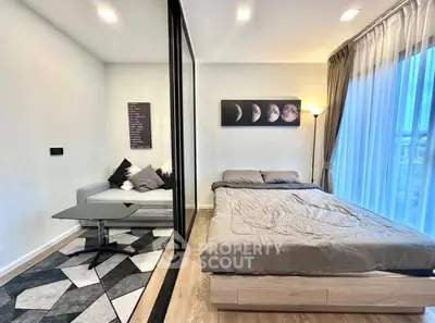 Modern bedroom with stylish decor and large window view