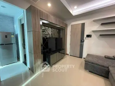 Modern living room with sleek design and open kitchen layout
