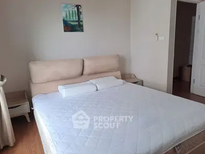 Cozy bedroom with modern decor and comfortable bed in a stylish apartment.