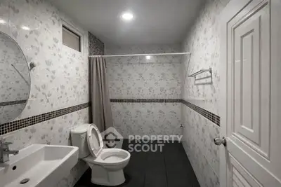 Spacious modern bathroom with elegant tile design and sleek fixtures