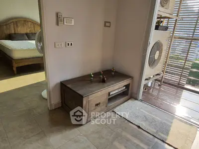 Cozy bedroom with wooden furniture and balcony access