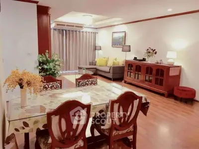 Spacious living room with elegant dining area and cozy seating, perfect for family gatherings.