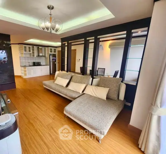 Spacious modern living room with open kitchen and elegant decor