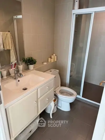 Modern bathroom with sleek shower and elegant vanity