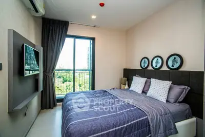 Modern bedroom with stylish decor and balcony view in urban apartment.