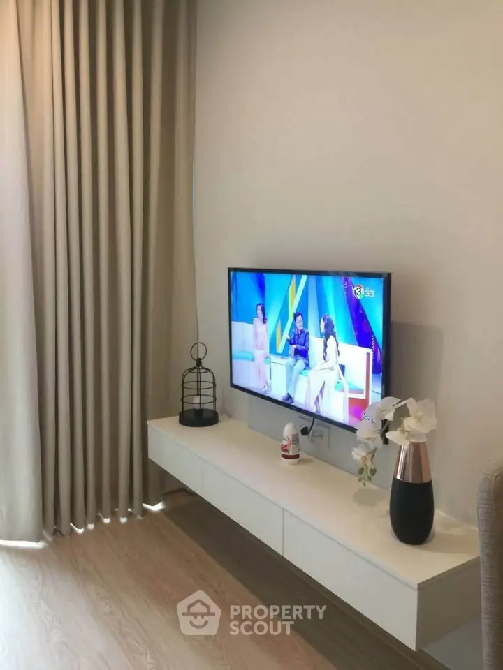 Modern living room with wall-mounted TV and elegant decor