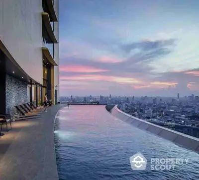 Luxurious rooftop infinity pool with stunning city skyline view at sunset