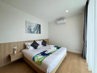 Modern bedroom with stylish decor and natural light