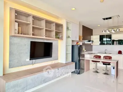 Modern open-layout kitchen with sleek cabinetry and built-in appliances, perfect for contemporary living.