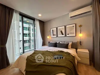 Modern bedroom with stylish decor and large window in a contemporary apartment.