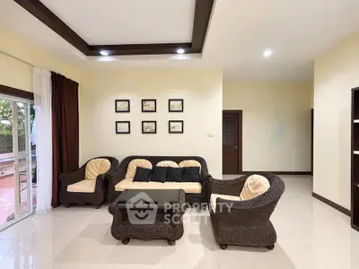 Spacious living room with elegant wicker furniture and modern decor