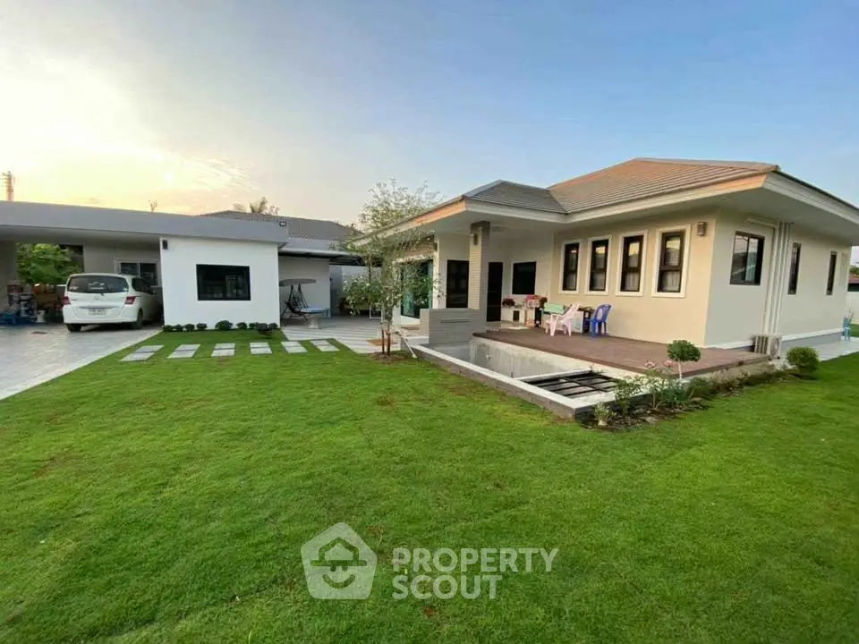 Charming suburban home with lush green lawn and modern exterior design, perfect for family living.