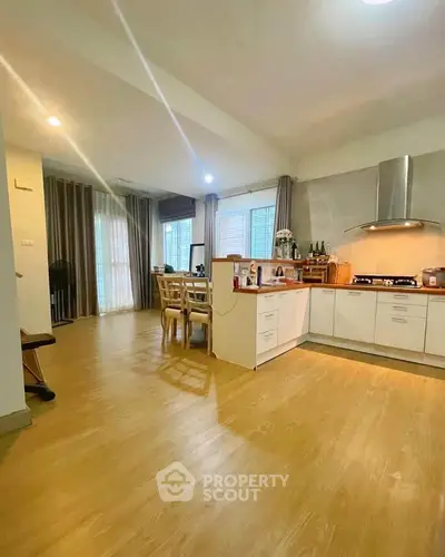 Spacious open-layout kitchen with modern appliances and dining area