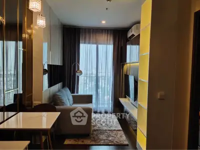 Modern living room with large window and stylish decor in a high-rise apartment.