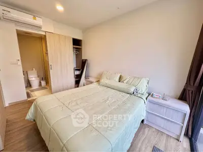 Cozy bedroom with ensuite bathroom and modern furnishings