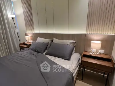 Modern bedroom with stylish decor and ambient lighting, featuring a cozy bed and elegant bedside tables.