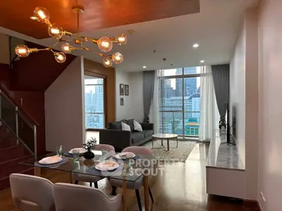 Modern living room with city view, stylish lighting, and elegant dining area.