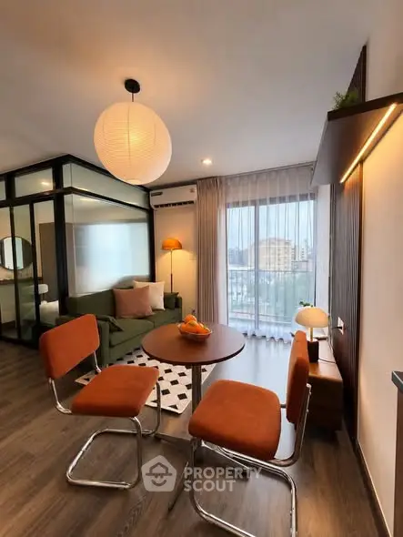 Modern living room with stylish furniture and large window view