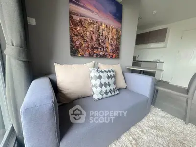 Modern living room with stylish sofa and cityscape artwork, perfect for urban living.