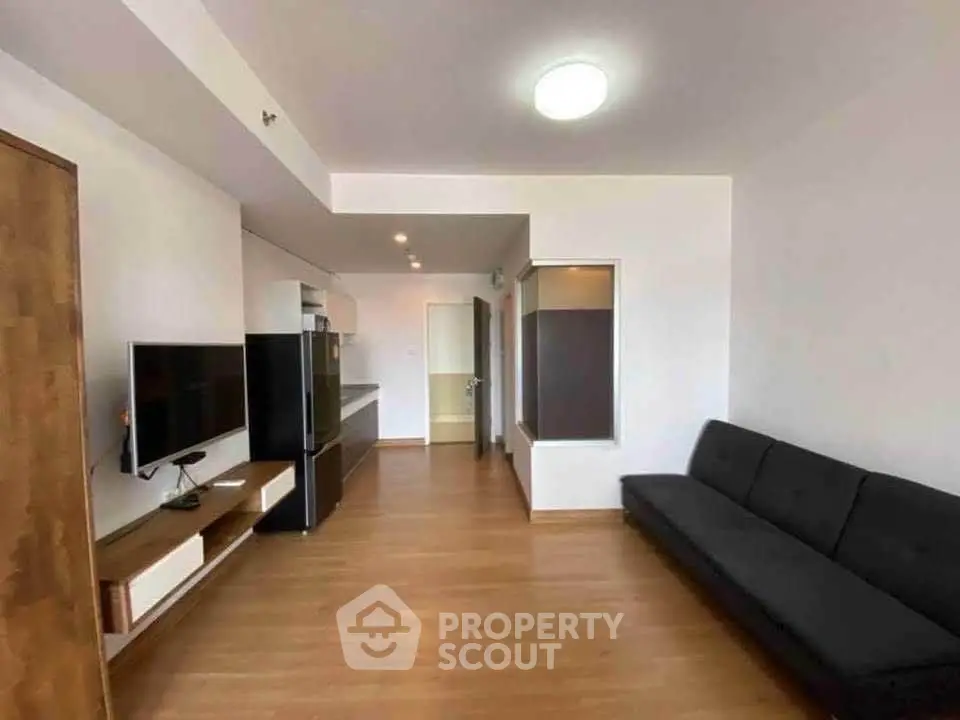 Spacious modern living room with sleek furniture and wooden flooring